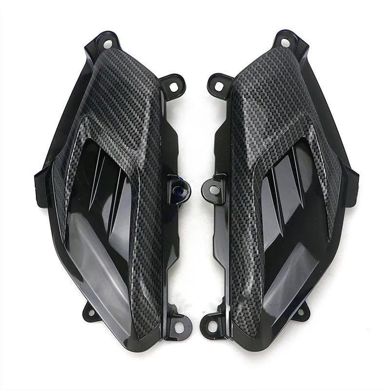 Pair of Yamaha NMAX LED side lamps with carbon fibre decoration, showing blue and red illumination options.