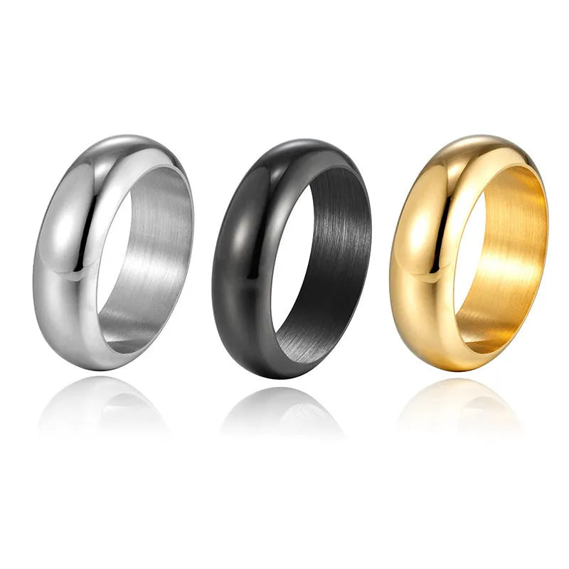 Glossy electroplated titanium steel ring in gold colour on a white background.