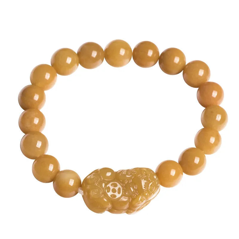 Carved golden thread jade money bracelet with traditional Chinese design showing detailed money motifs