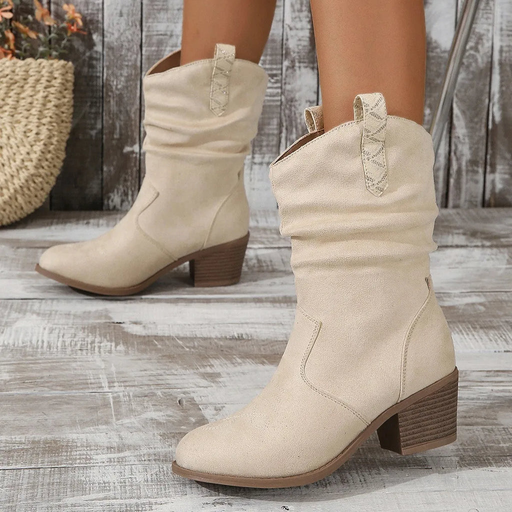 Mid-calf suede women's boots in lotus root colour with leather stitching and a mid-height rubber sole.