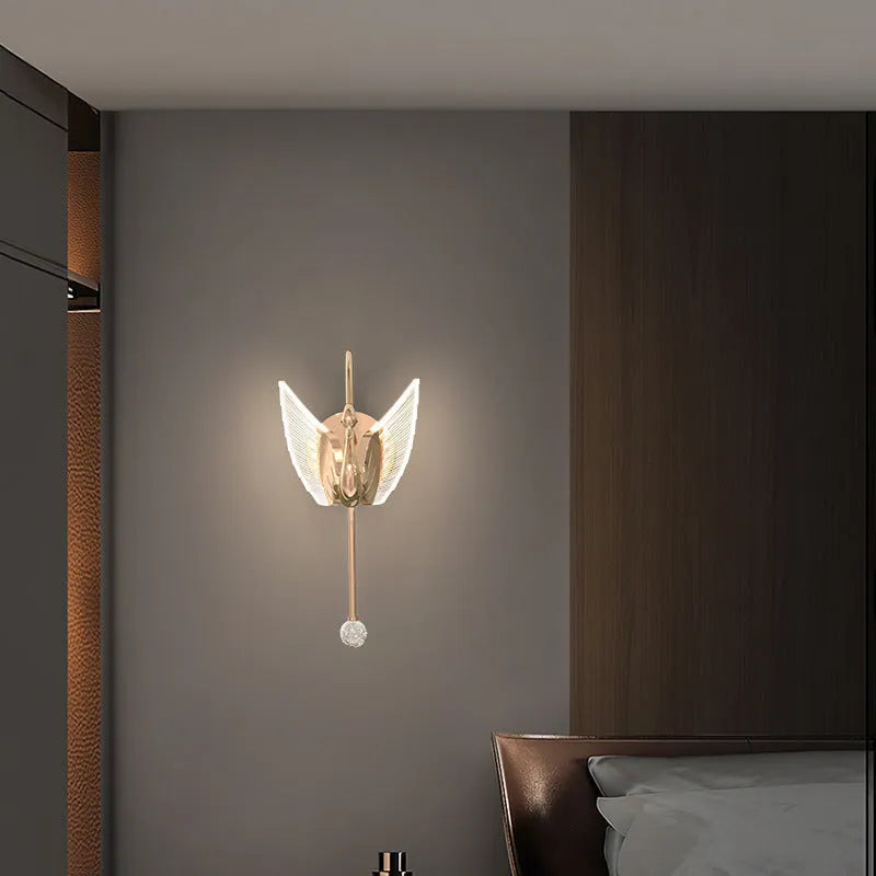 Gold swan-shaped wall lamp with iron construction and acrylic shade