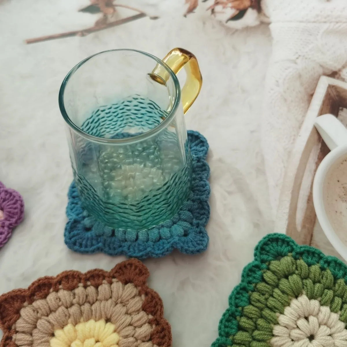 Crocheted wool grandmother lattice insulated cup placemat in four colours Emerald Sea Salt Blue Dream Purple Fog Brown