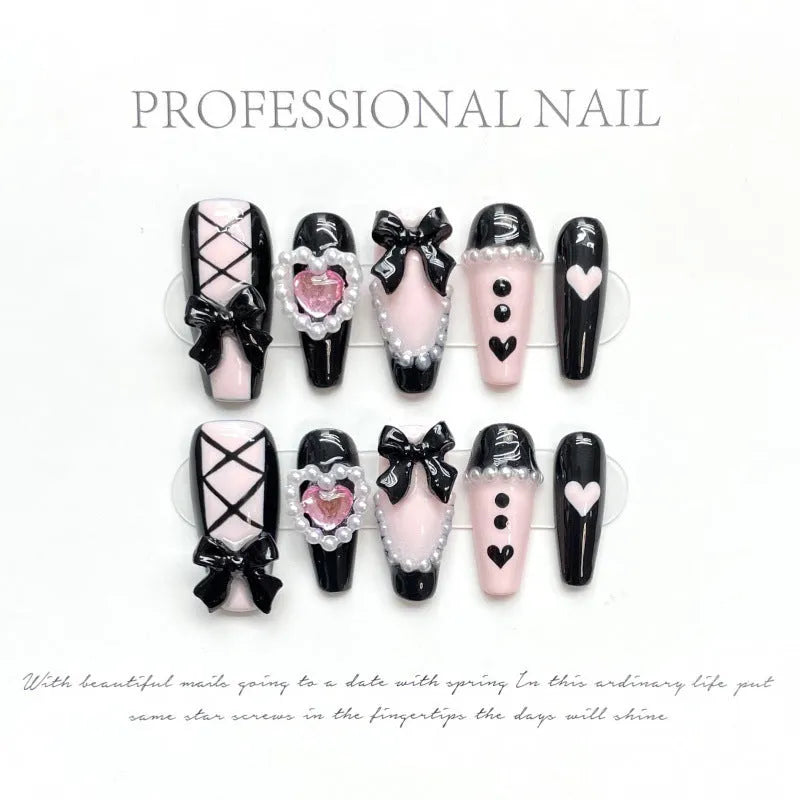 Black peach heart detachable manicure nails with hand-painted bow and XINGX patterns