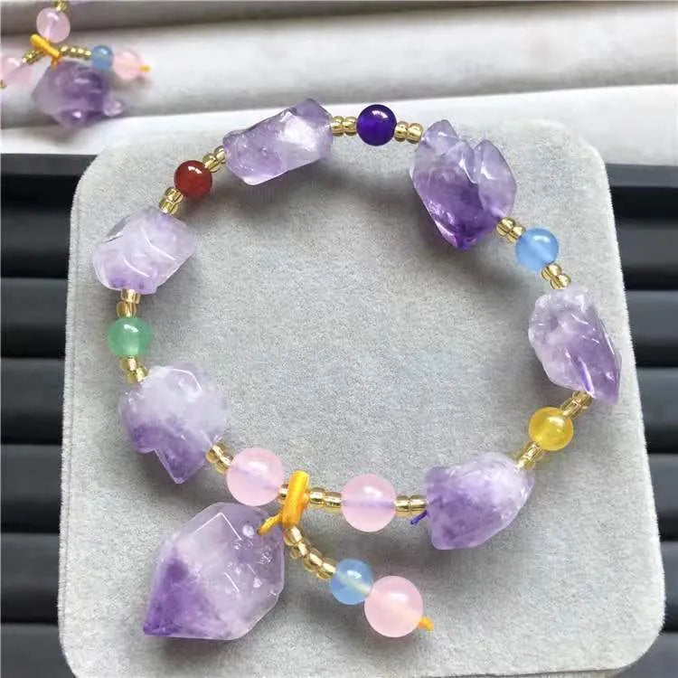 Natural shaped amethyst bead bracelet for women with a fu character charm.