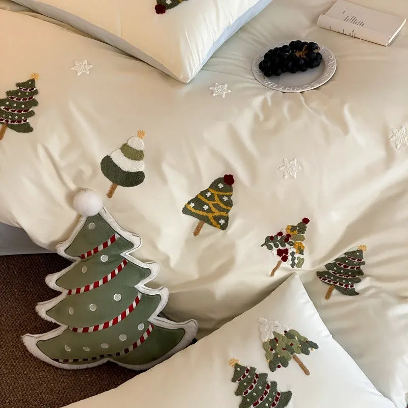 Cream Blue cotton bedding set with embroidered Christmas tree and floral pattern, showing duvet cover and pillowcases.