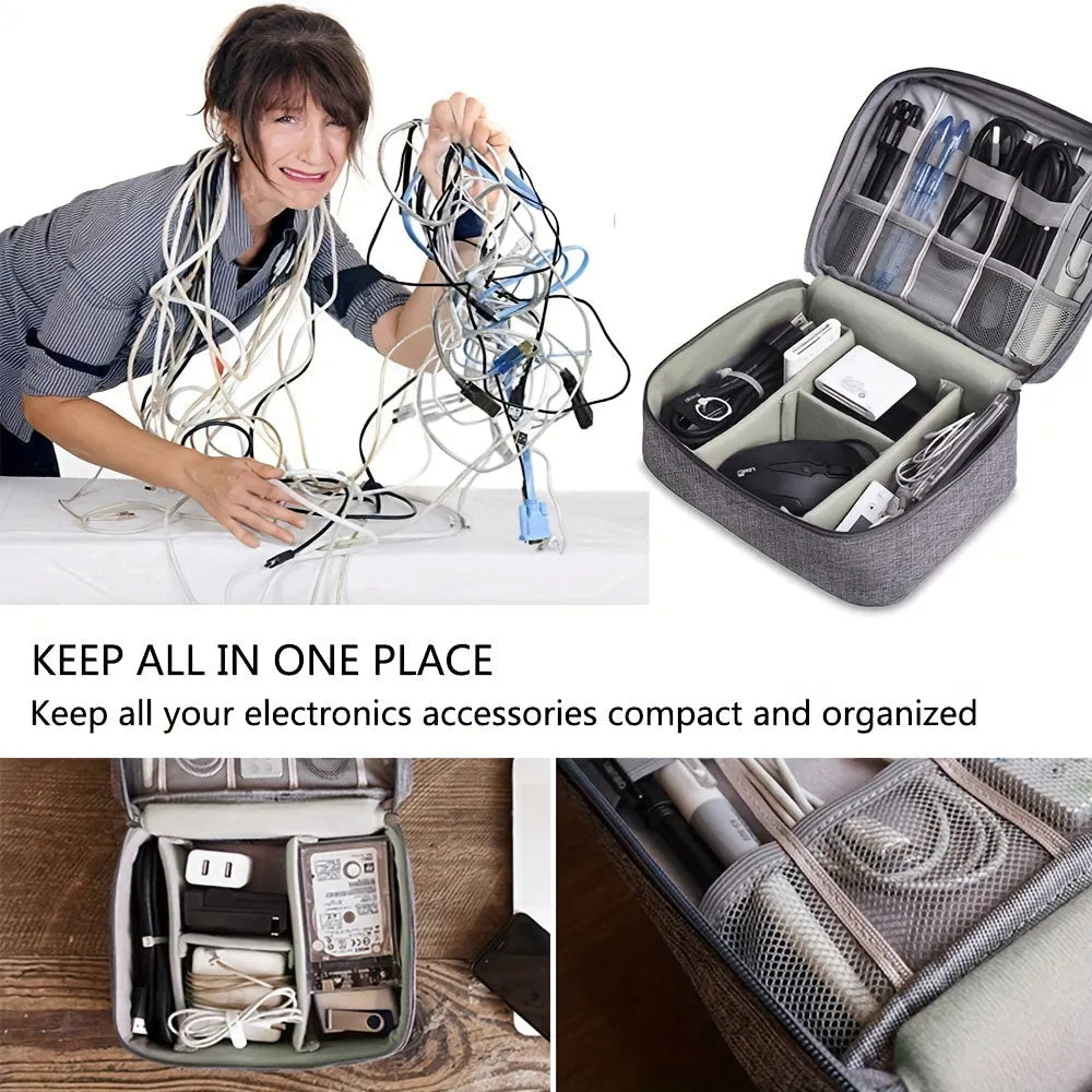 Black electronics organiser case open to show mesh pockets, elastic loops and removable padded dividers inside.