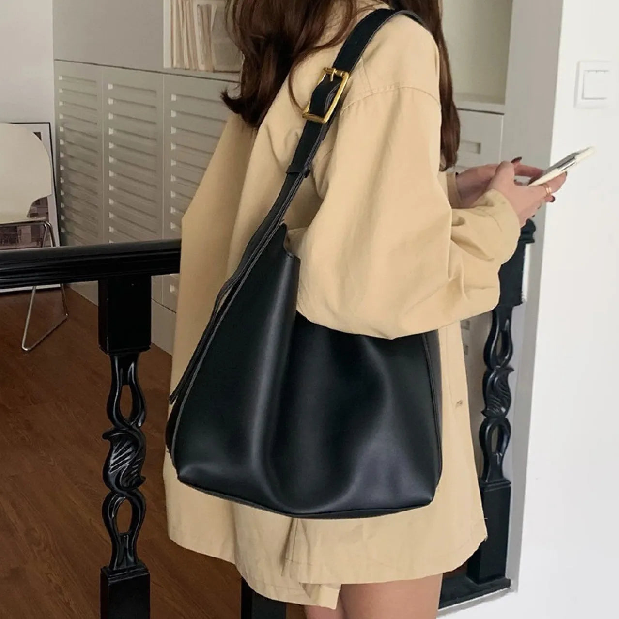 Women's soft PU shoulder bag with swing threads in black ribbon or brown colour options