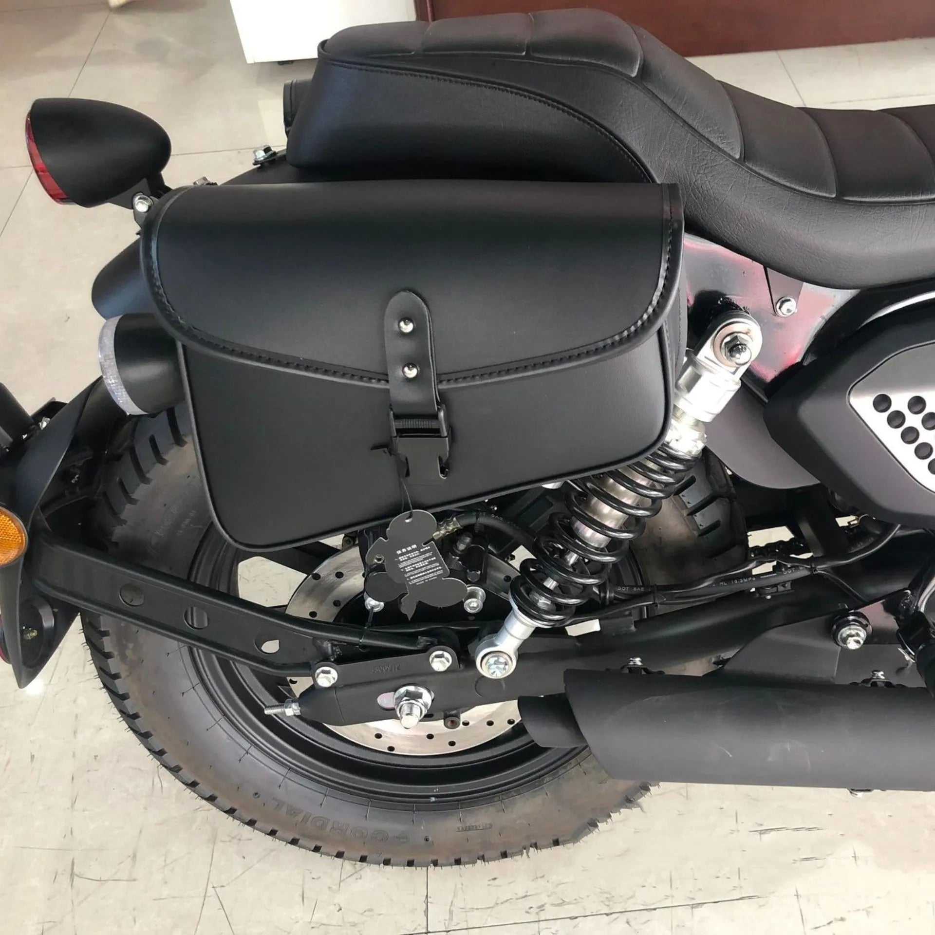 Black PU leather motorcycle swingarm saddlebag for Harley Sportster mounted on bike