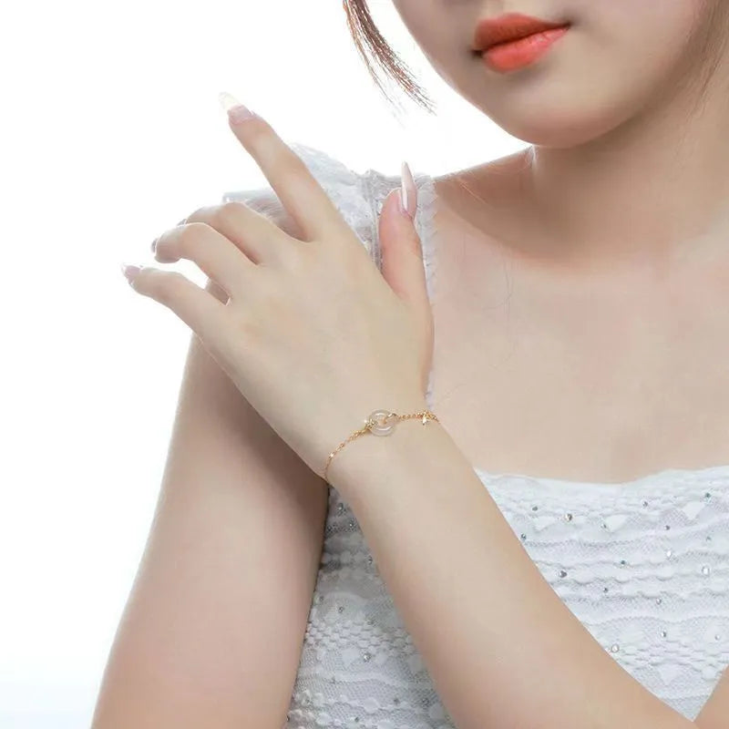 White chalcedony bracelet with peace buckle in silver gold electroplated finish on silver base