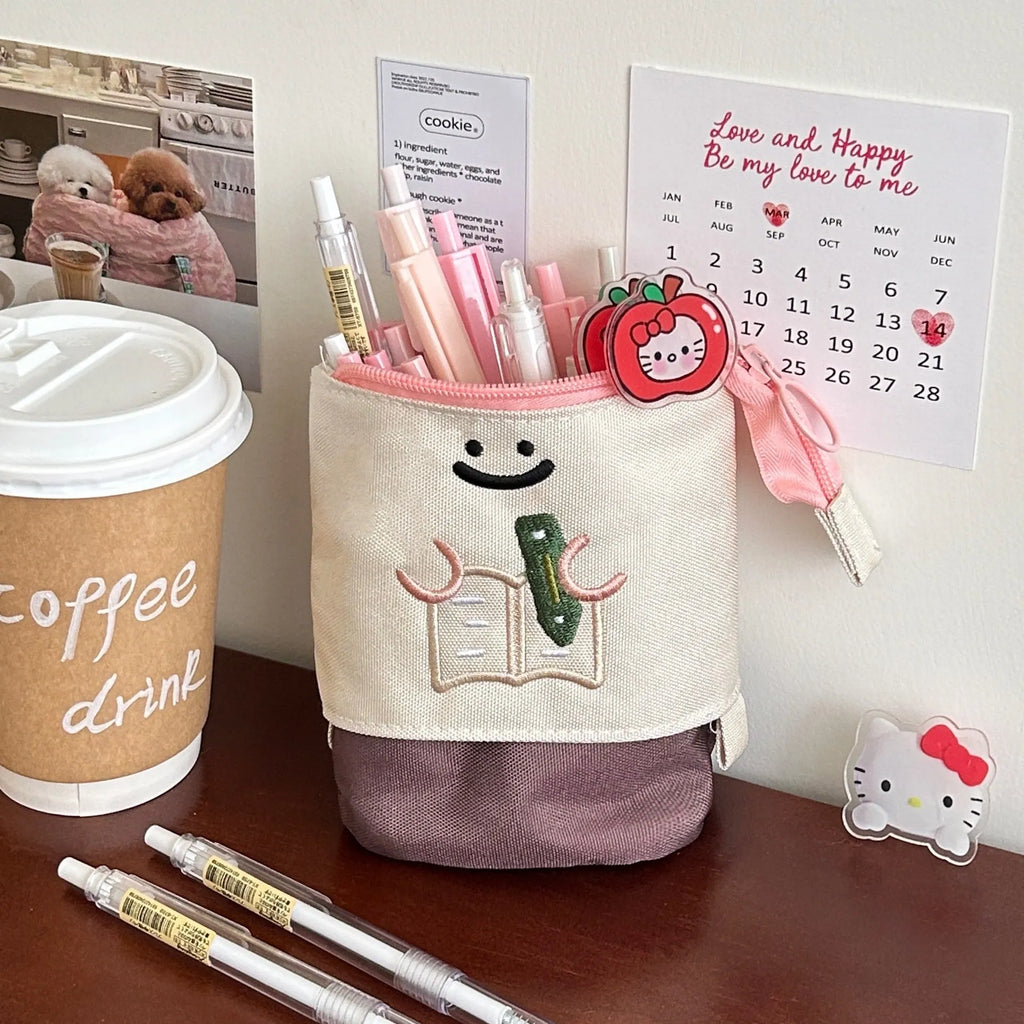 Brown and green cartoon design collapsible pencil case with zipper, showing flat and expanded states.