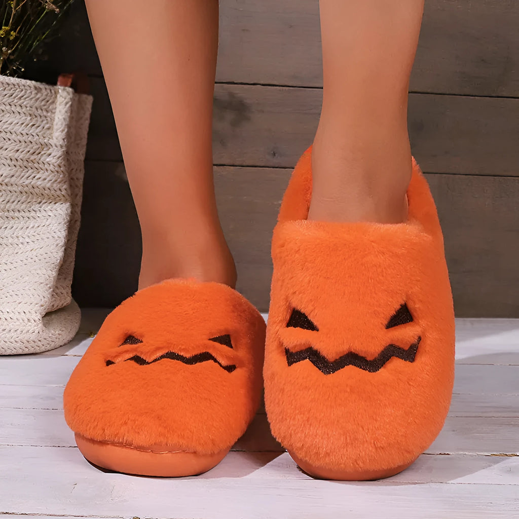 Orange plush-lined indoor slippers with non-slip PVC soles and coral velvet upper