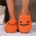 Orange plush-lined indoor slippers with non-slip PVC soles and coral velvet upper
