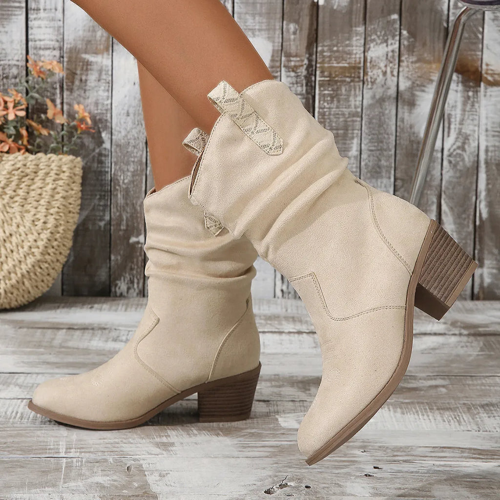 Mid-calf suede women's boots in lotus root colour with leather stitching and a mid-height rubber sole.
