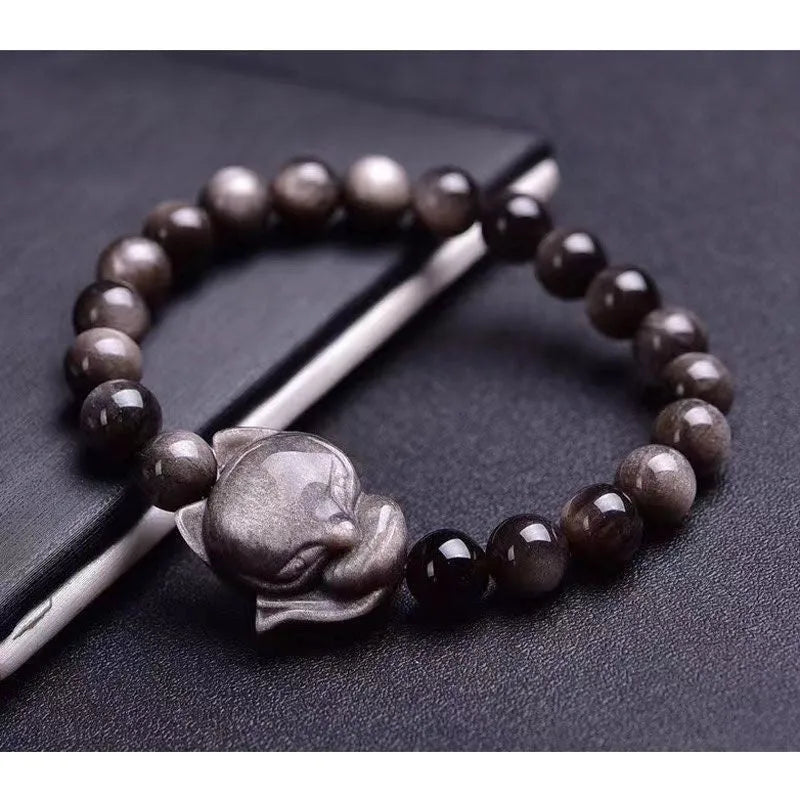 Obsidian bracelet with fox ring charm on 8mm polished black stone beads showing adjustable sliding knot closure