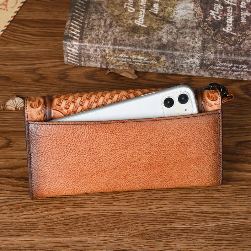 Brown genuine leather tri-fold wallet with embossed floral pattern showing interior compartments