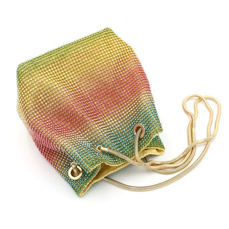 Rainbow coloured rhinestone bucket bag for women with adjustable fabric strap.