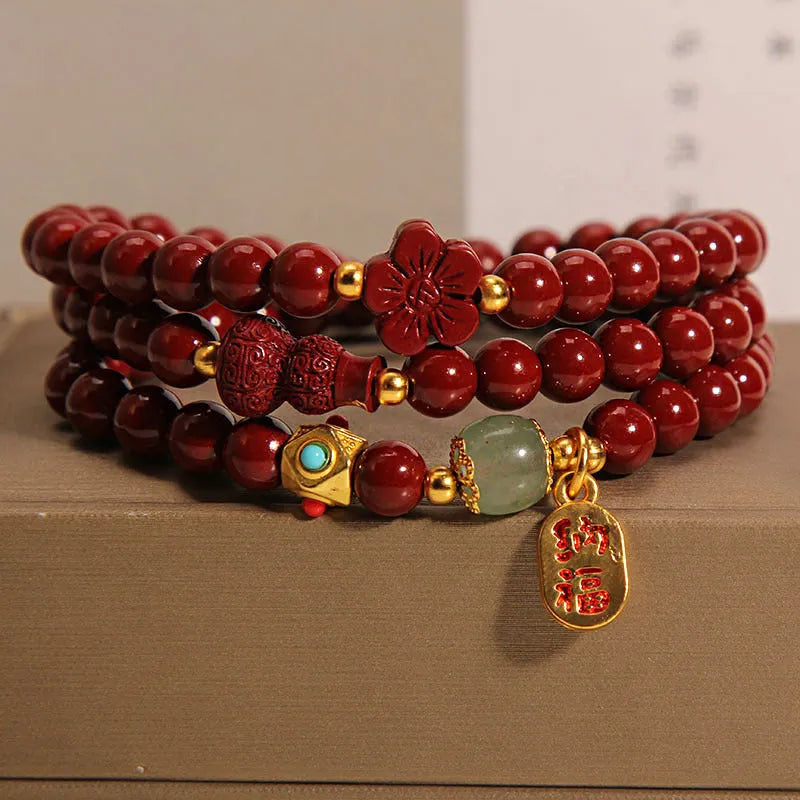 Polished cinnabar gourd five petal flower bracelet 6mm multi-circle on display