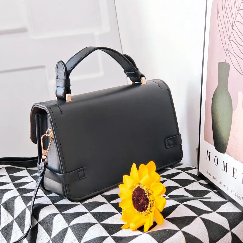 Small square ethnic crossbody bag in apricot PU leather with stitching and plaid patterns.