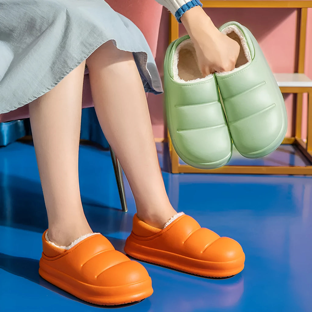 Women's waterproof EVA winter house slippers in multiple colours with plush lining and non-slip sole.