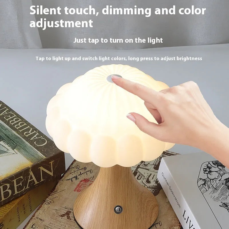 Small mushroom-shaped night lamp in wood grain colour with USB charging port and touch control.