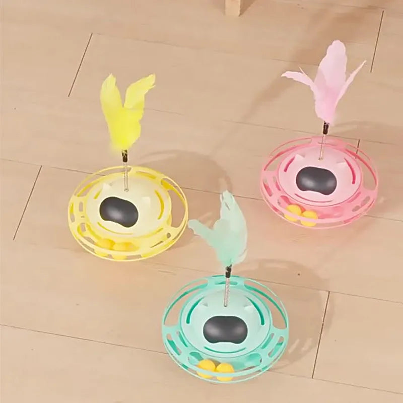 Pink cat tumbler turntable toy with rotating base and attached stick on white background