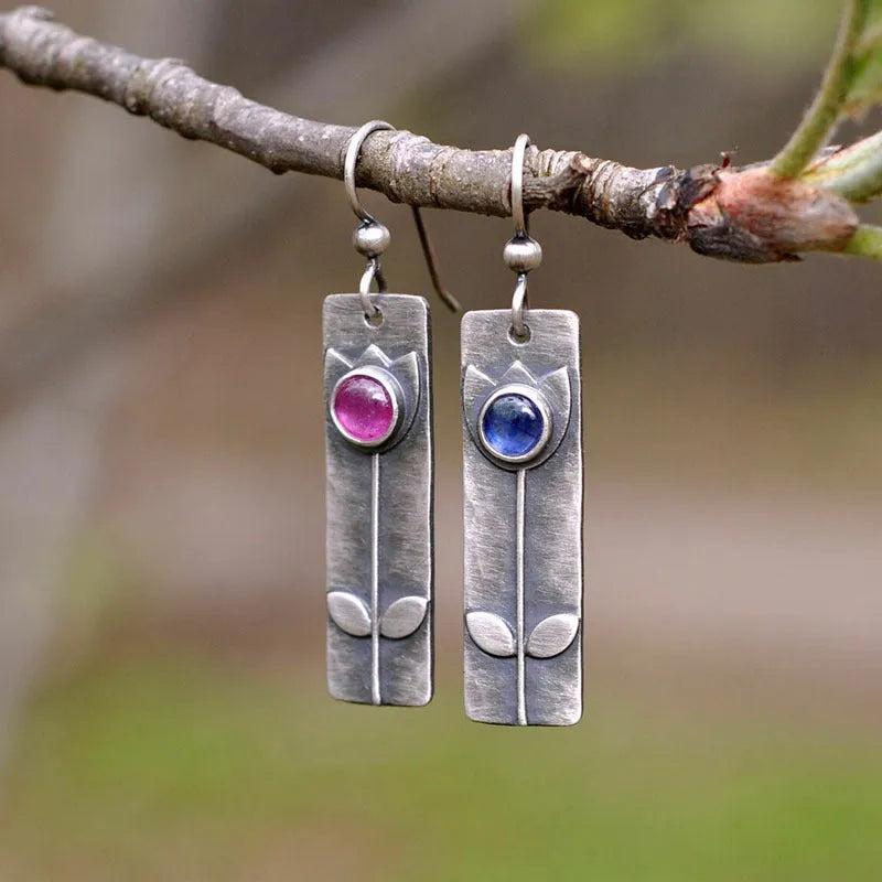 Antique finish red sapphire geometric earrings with ellipse shapes and electroplated metal construction