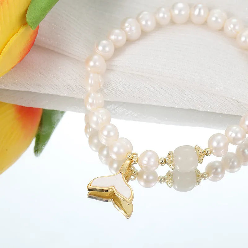 Natural freshwater pearl fishtail bracelet for women, handmade original design on display