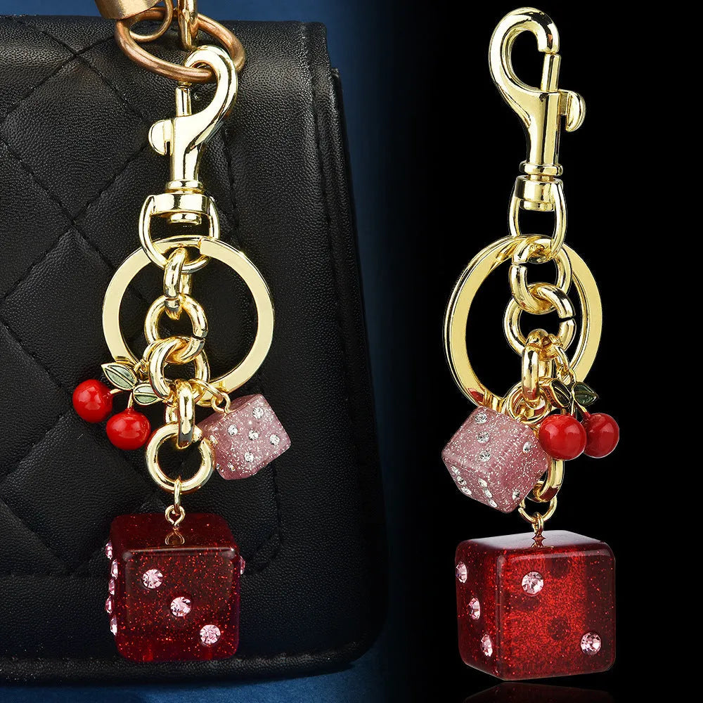 Square pattern metal keychain pendant with two-tone cherry dice design and electroplated finish