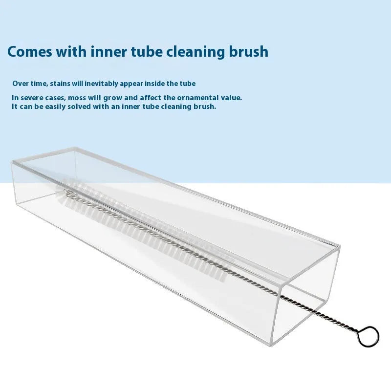 Plastic fish tank feeding tube set with cleaning brush and feed spoon on white background