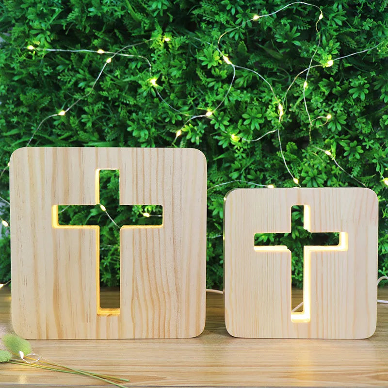 Solid wood hollow night lamp with warm white LED light, USB cable, and button switch on a wooden table