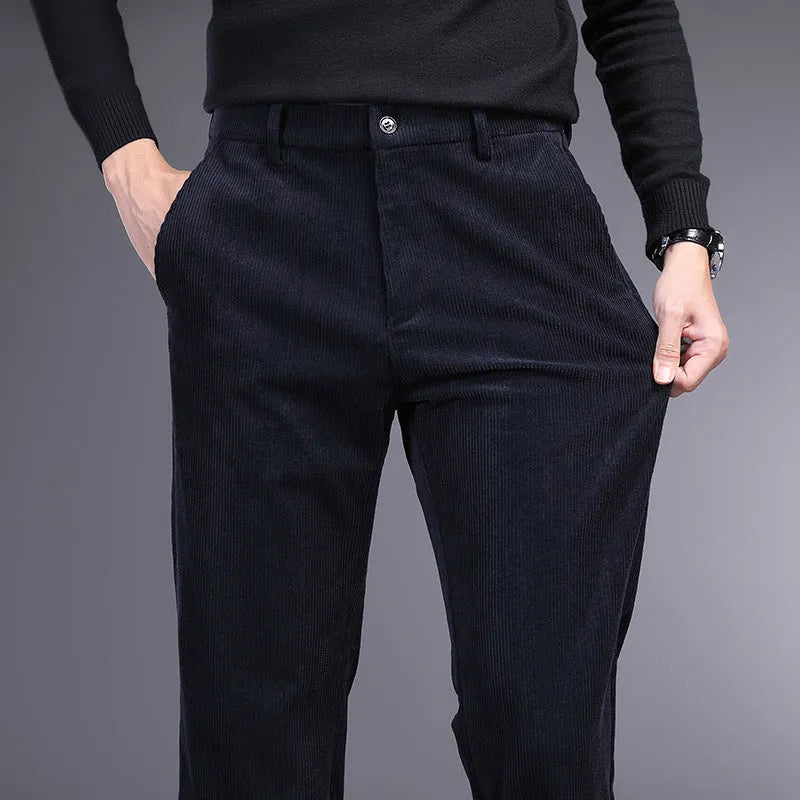 British retro style straight-leg striped trousers in a neutral colour on a hanger.