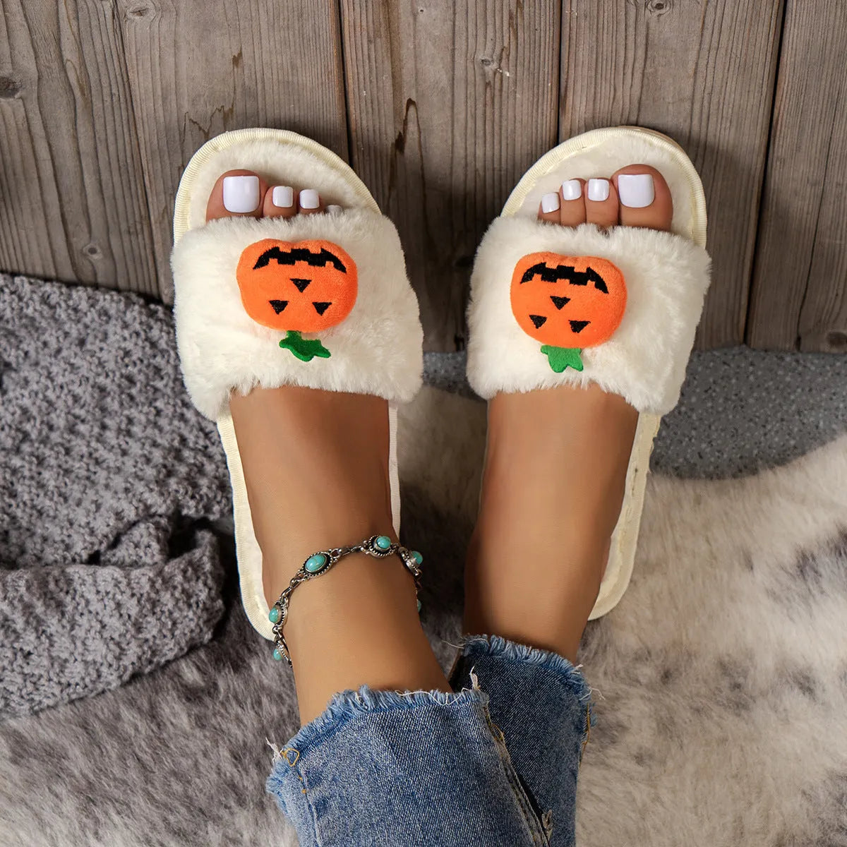 White and yellow Halloween pumpkin cartoon plush slippers with open toe and PVC sole.
