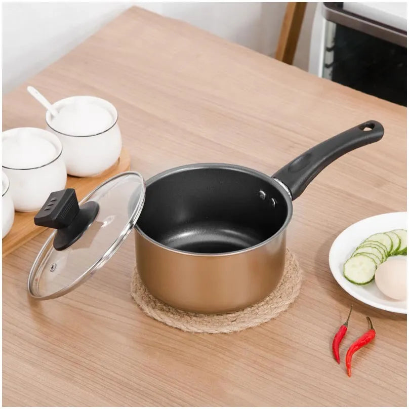 Three-piece cast iron non-stick cookware set with soup pot, milk pot, and wok in light luxury style