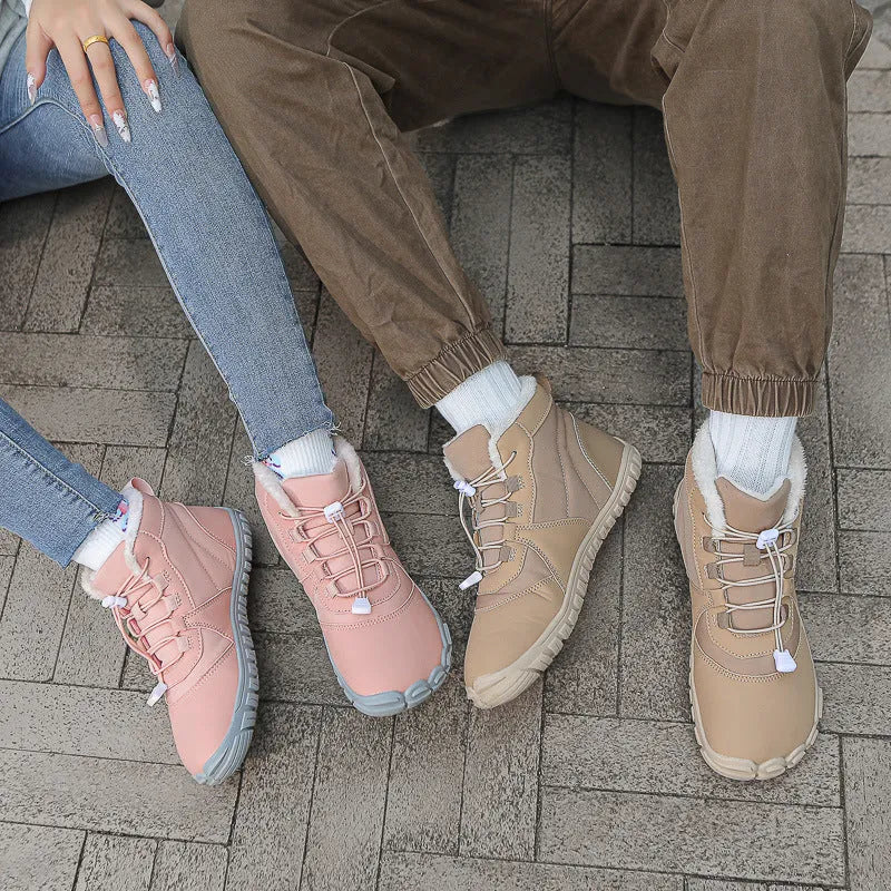 Outdoor snow boots with lace-up front, round toe, and black rubber sole shown in khaki colour.