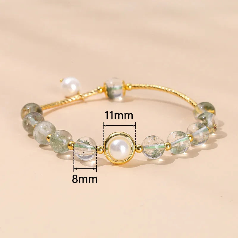 Handmade crystal agate bracelet with cute fruit and bow shapes on a white background