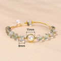 Handmade crystal agate bracelet with cute fruit and bow shapes on a white background