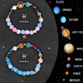 Set of two natural stone beaded bracelets with zodiac sign charms on a wrist.