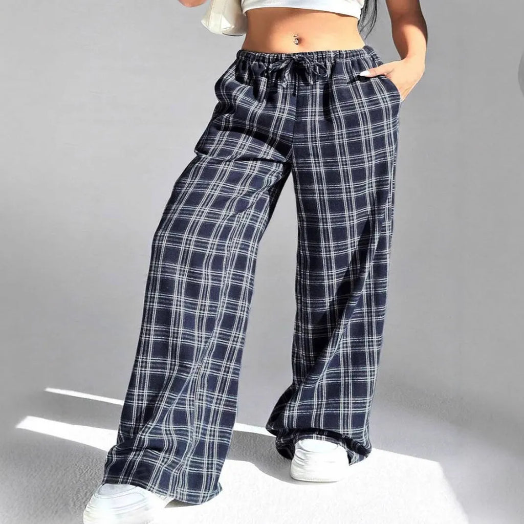 Women's red casual loose trousers with drawstring waist and plaid patch pockets laid flat.