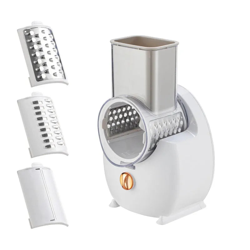 Electric vegetable slicer in white with feeding port, pressing rod, and blade barrel on a kitchen counter