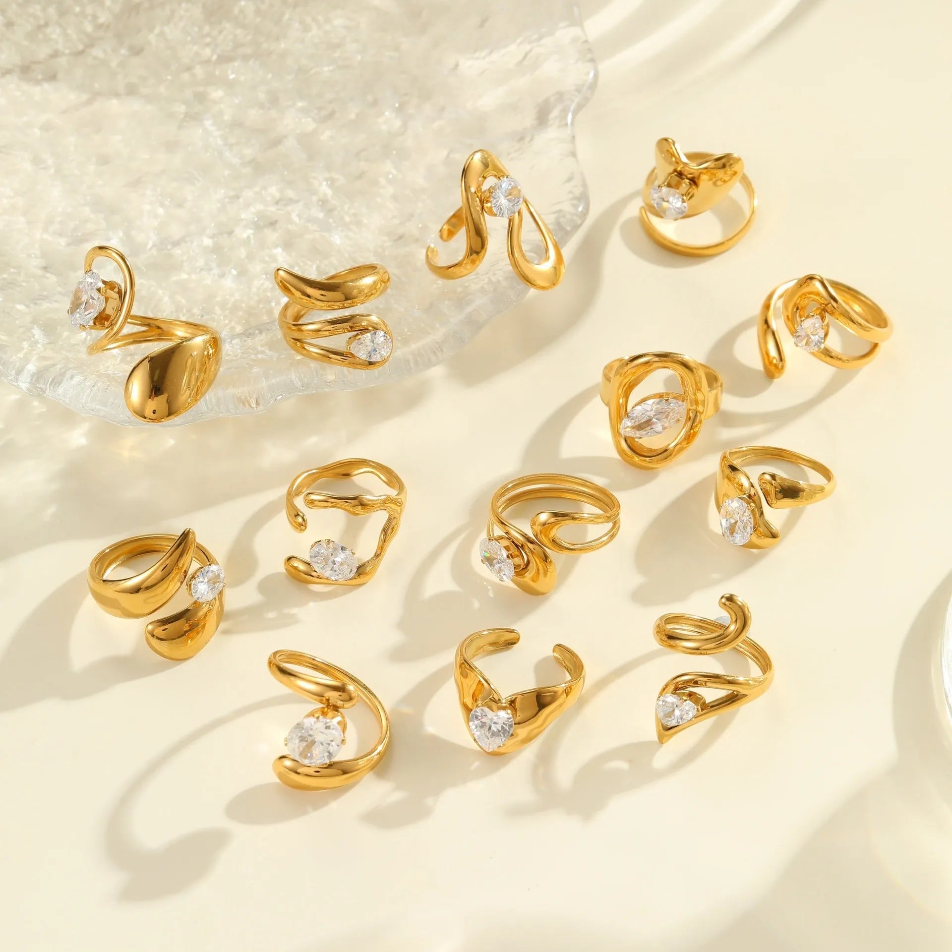Adjustable geometric zircon ring in stainless steel with electroplated finish showing open-mouth design