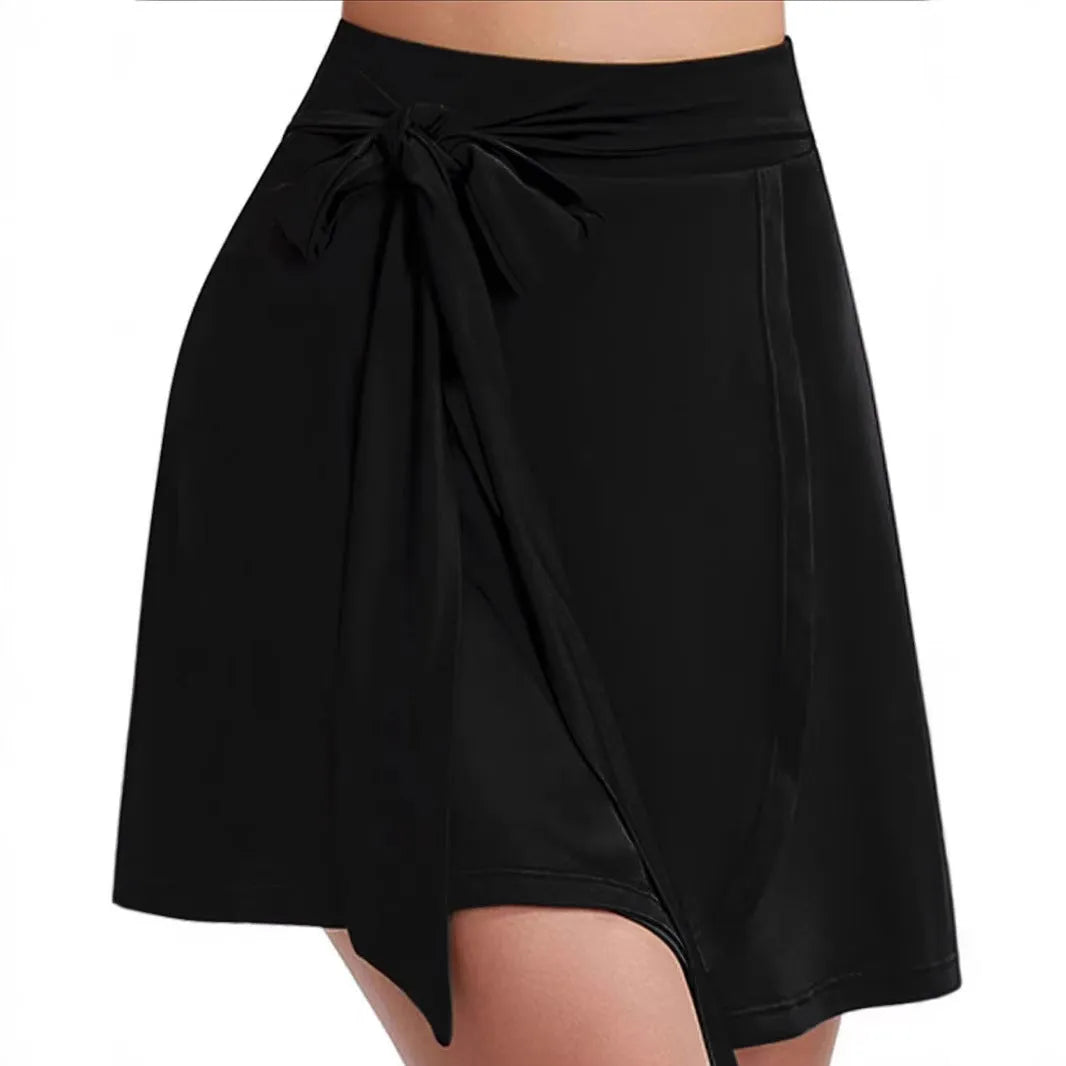 Black thigh-length anti-exposure sports skirt with built-in shorts showing high waist and shoulder strap details