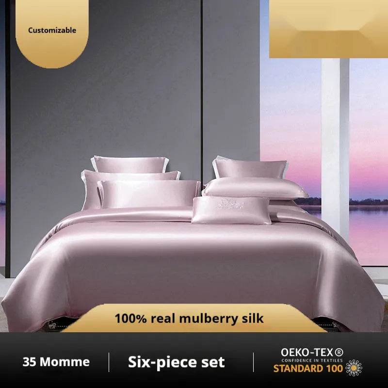 Solid colour silk four-piece bedding set in Champagne Gold on a bed, showing quilt cover and pillowcases.