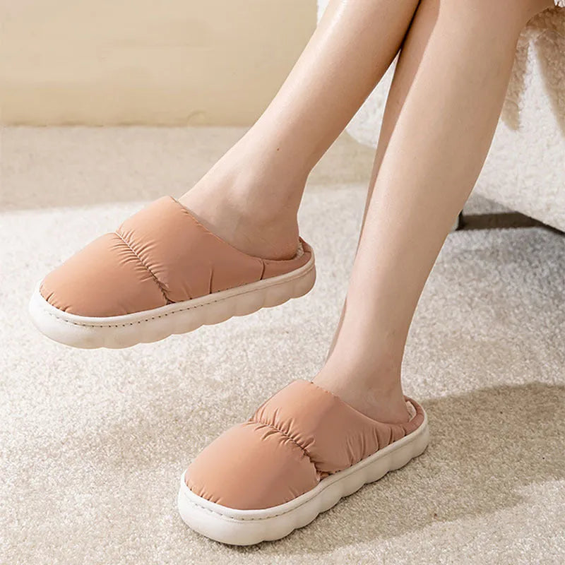 Blue winter house slippers with artificial leather upper, thick rubber sole, and plush lining.