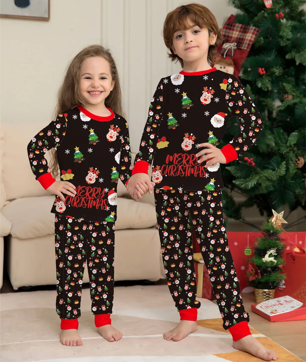 Family wearing matching red plaid Christmas pyjamas, including parents, children, baby, and dog.