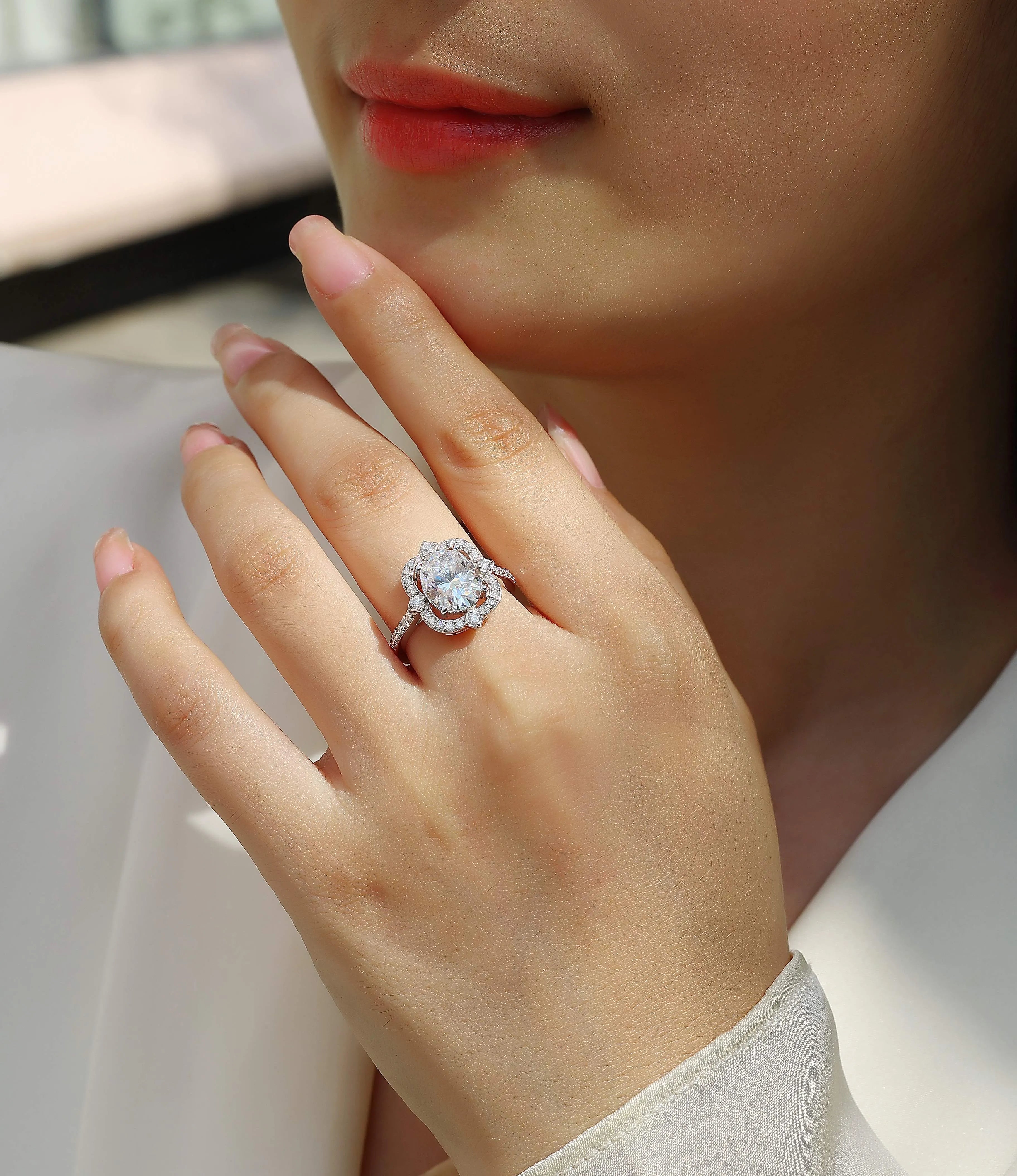 Camellia moissanite wedding ring with egg-shaped 8x10mm stone in S925 silver platinum-plated setting