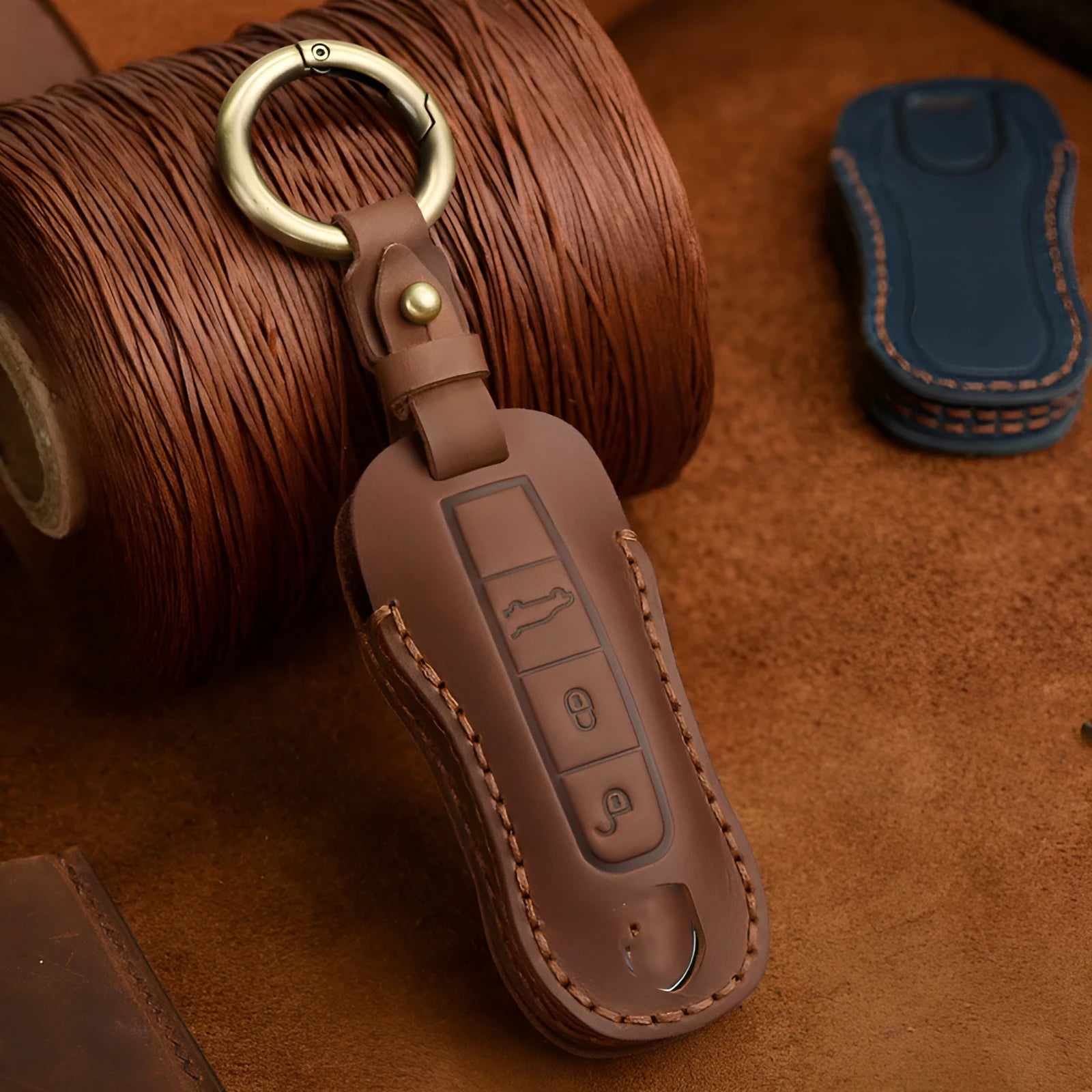 Authentic brown cowhide leather Porsche key cover with a retro metal bag buckle closure.