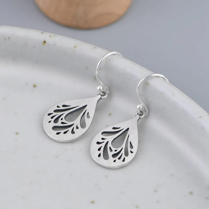 Retro 925 silver hollow water drop shape earrings for women, small stud style with hand ground finish
