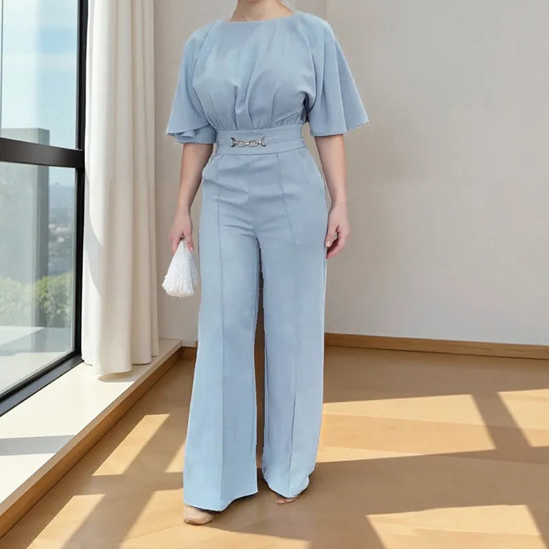 Blue polyester two-piece men's suit with long sleeves and trousers on a hanger