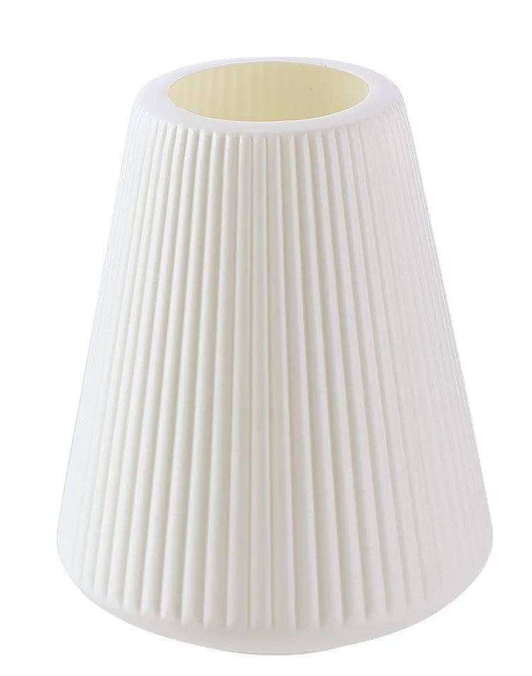 Colourful melamine plastic decorative flower vase on a desktop, 16cm wide by 20cm tall.