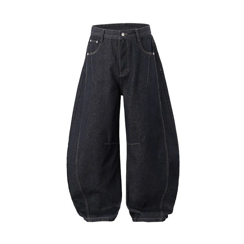 Men's original cow colour wide-leg denim trousers laid flat, showing mid-waist and full-length legs.